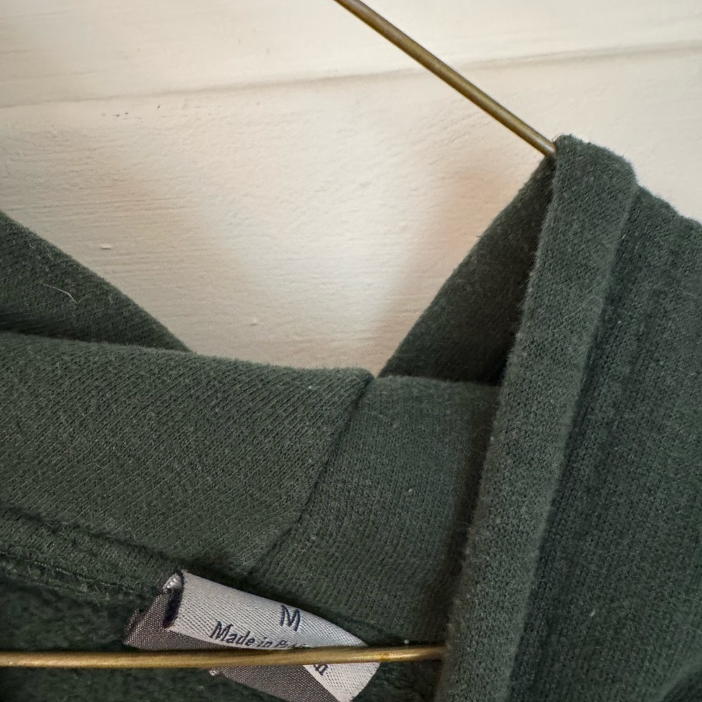 Dark Green Cozy Sweater. Official Oswego State merch.